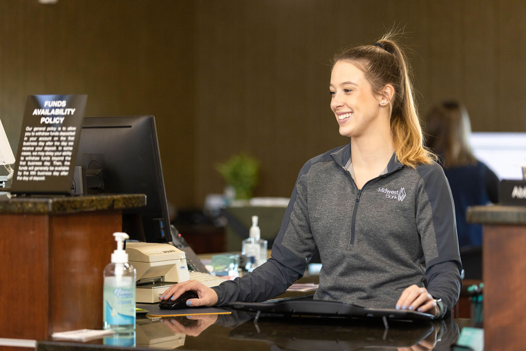 Abbey working the front desk in the Lincoln branch